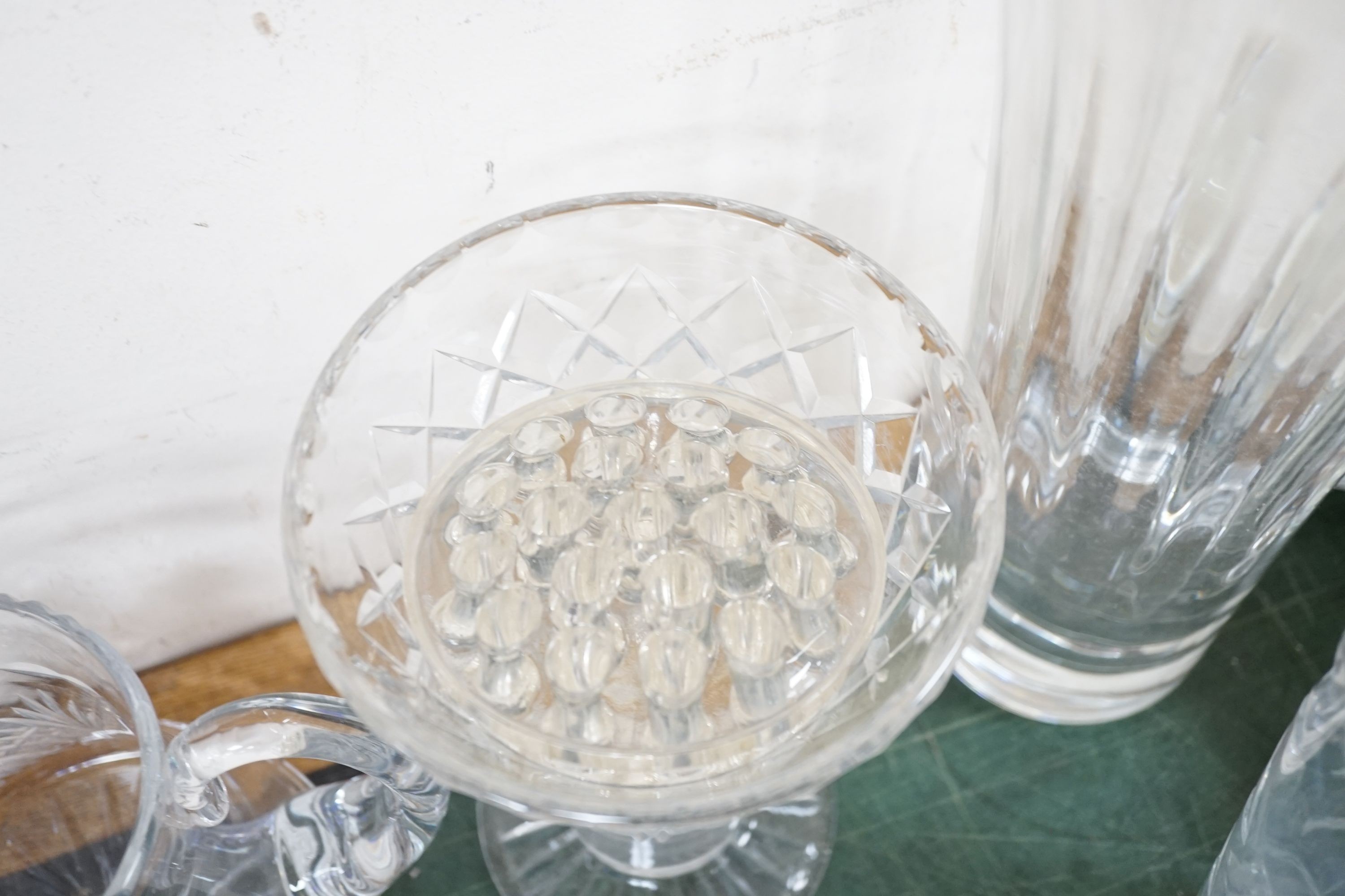 A quantity of cut crystal and other glassware to include decanters, vases, bowls etc